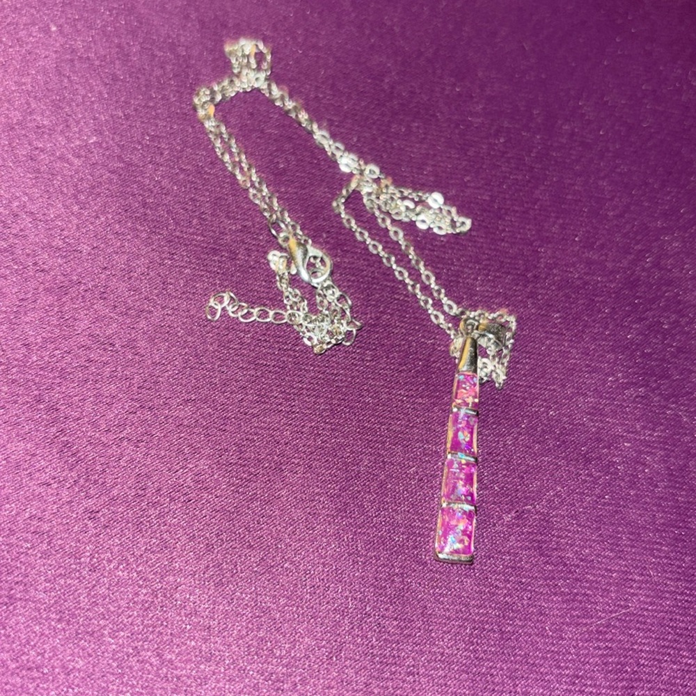 Medium length silver chain with blue and purple flecked charm